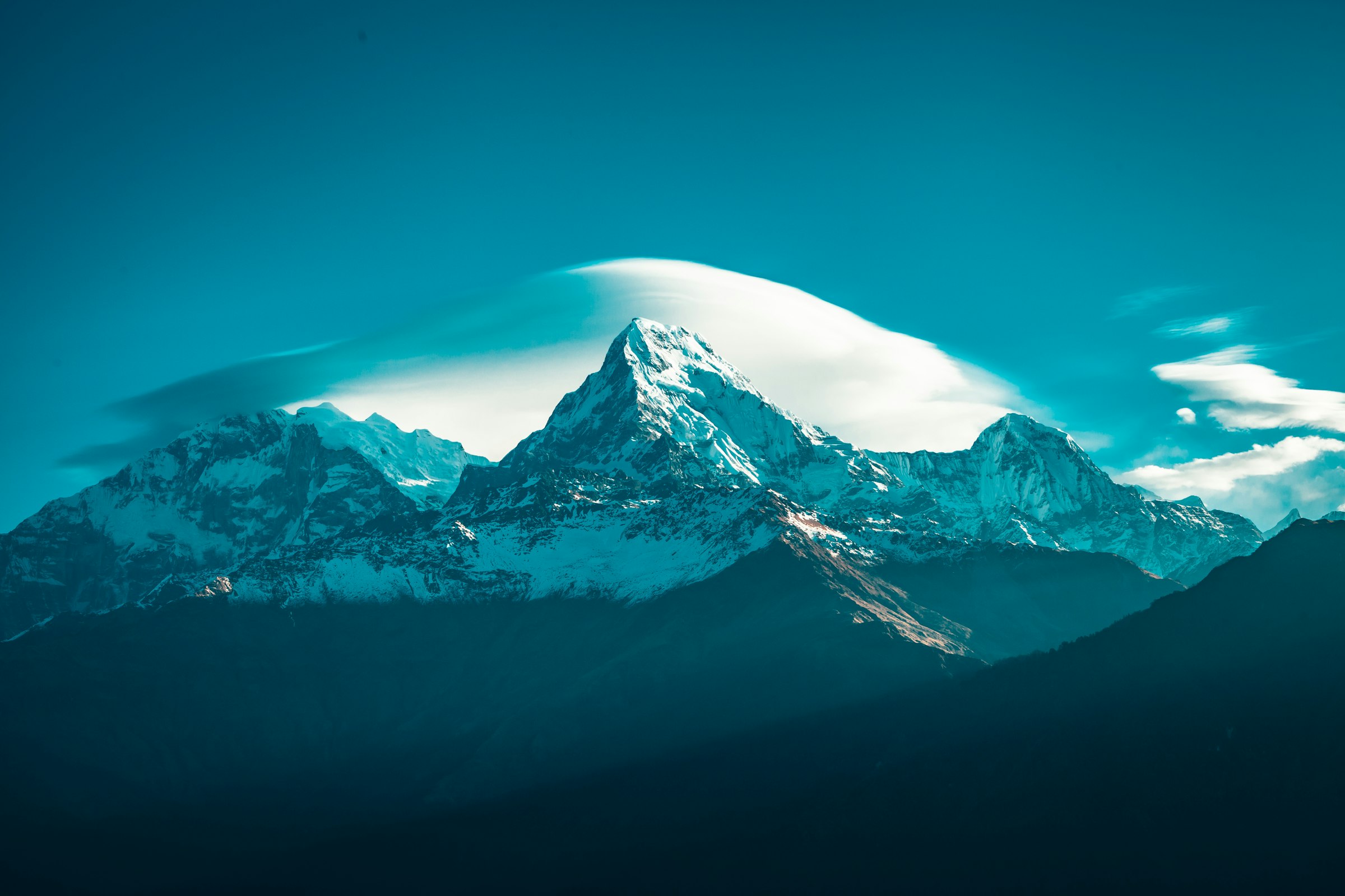 Snow-capped Himalayan peaks under a clear sky